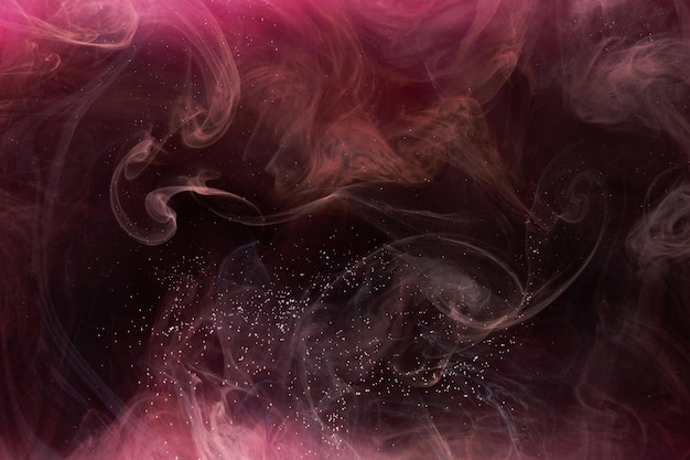 Pink smoke on black ink background, colorful fog, abstract swirling touch ocean sea, acrylic paint pigment underwater