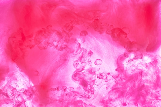 Pink smoke ink background colorful fog abstract swirling touch ocean sea acrylic paint pigment underwater