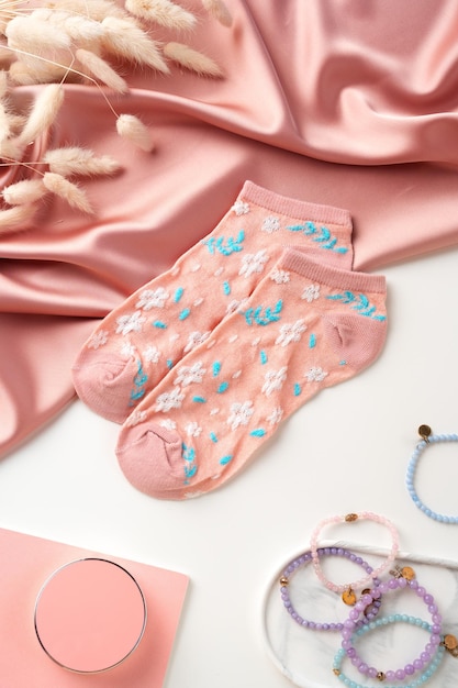 Pink socks with pattern on white background