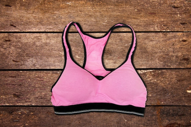 Photo pink sporty bra on table