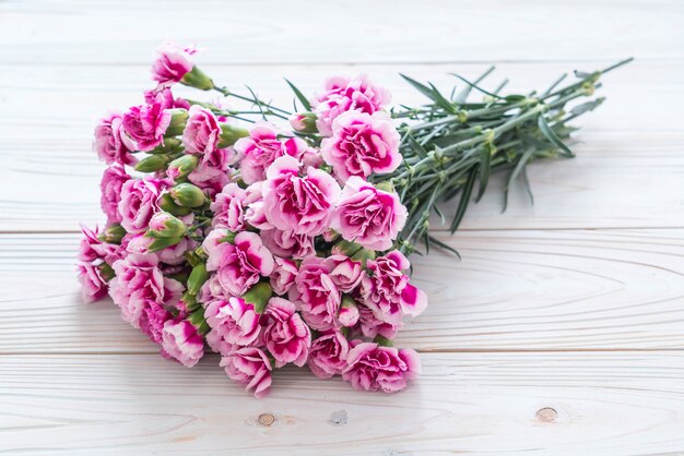 pink spring flower on wooden background