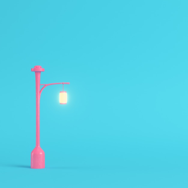 Pink street light on bright blue background