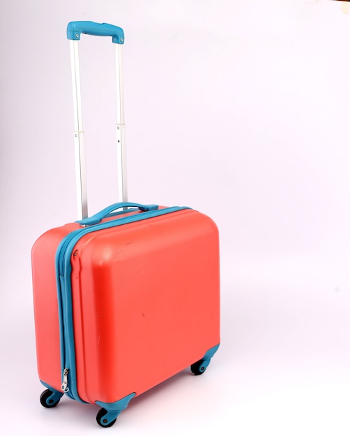 Pink suitcase isolated on white background.