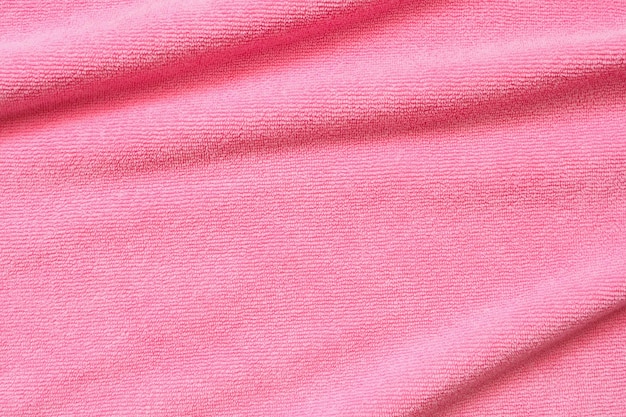 Pink towel fabric texture surface close up background