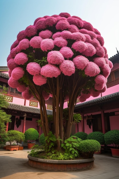 Photo a pink tree with a large pink flower on it.