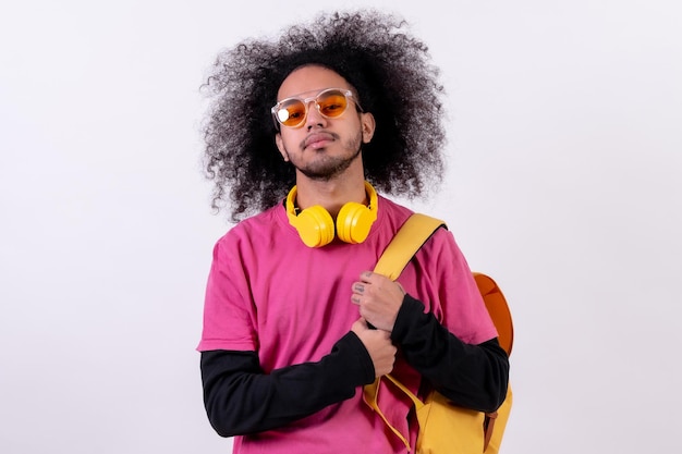 Pink tshirt and backpack for college Young man with afro hair on white background