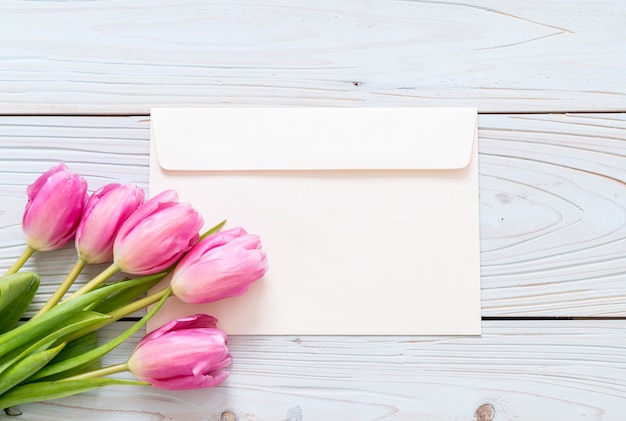 pink tulip flower on wood background