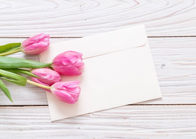 pink tulip flower on wood background