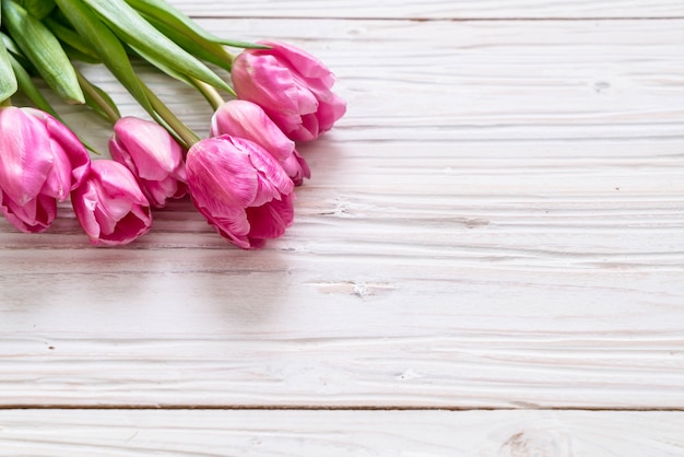 pink tulip flower on wood