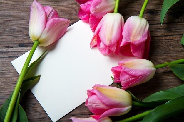 pink tulips with postcard