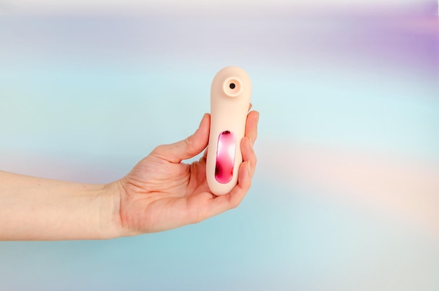 Pink vacuum wave vibrator for clitoral stimulation in an elegant female hand sex toy for women