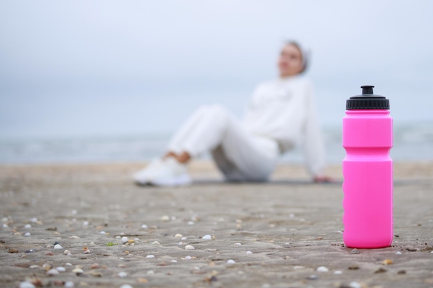 Pink water bottle on the ground High quality photo