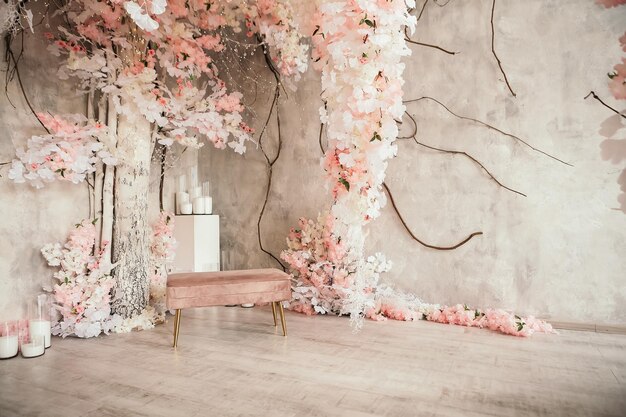 Pink wedding photo zone in studio made of white flowers