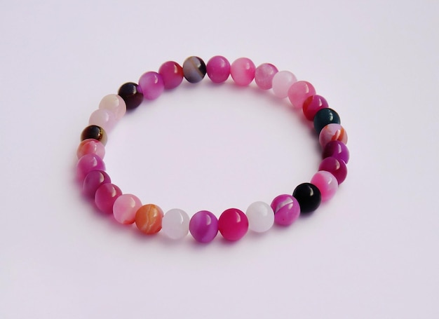 pink and white bracelet made by natural stone