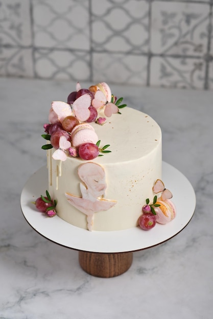 Pink and white cake for a girl Dessert decorated with chocolate and pasta