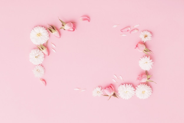 Pink and white flowers on pink paper background