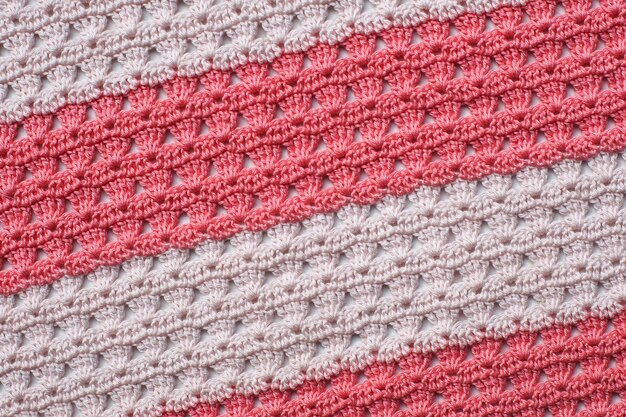 Pink and white knitted knitting pattern, stipes.