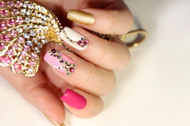 Pink and white manicure with rhinestones