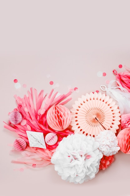 Pink and white Paper Decorations for Baby  party. Flat lay, top view