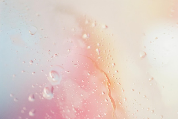 Photo a pink and white picture of a water droplet with the words bubbles on itsoft light flare transpar