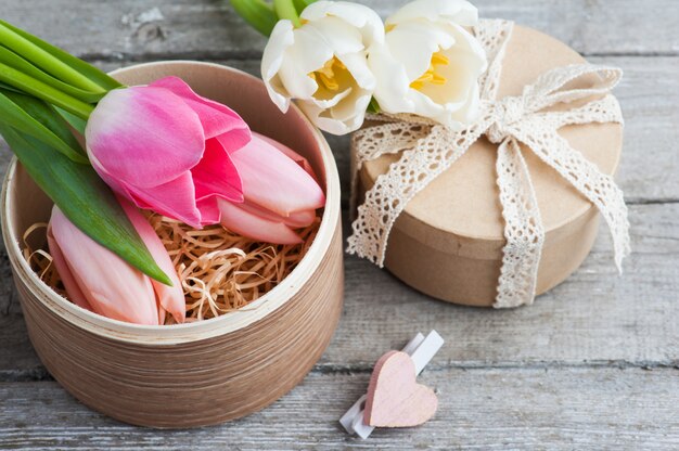 Pink white tulip flowers and craft gifts