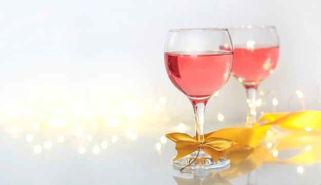 Pink wine in glasses with beautiful lights