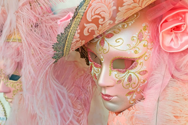 Pink and yellow Venetian masks