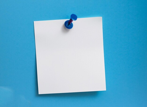 Pinned white blank paper note on blue background generarive ai