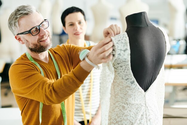 Pinning up sleeve of dress