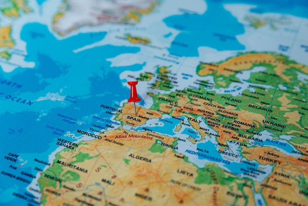 pins on the map close up to spain soft focus