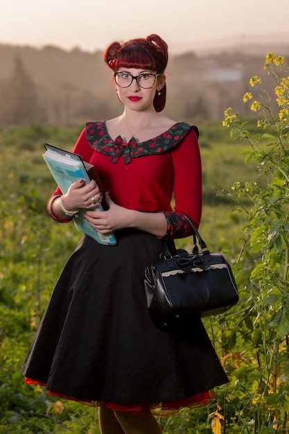 Pinup girl holding books