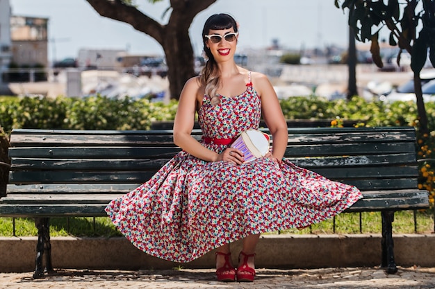 Pinup girl relaxing in the park