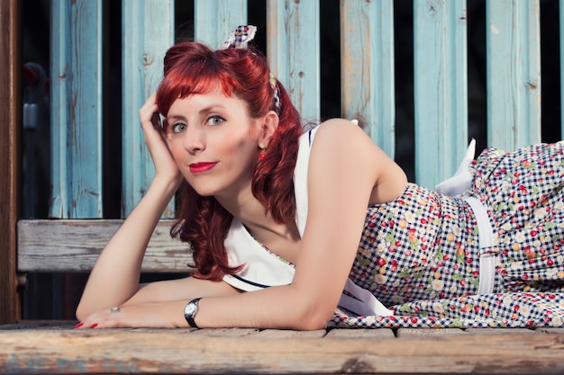 Pinup young woman in vintage style clothing