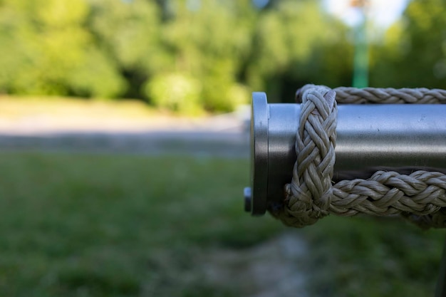 A pipe from a hammock in the park