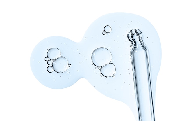 Pipette and drops of cosmetic serum for the skin Liquid body care product Isolated on a white background