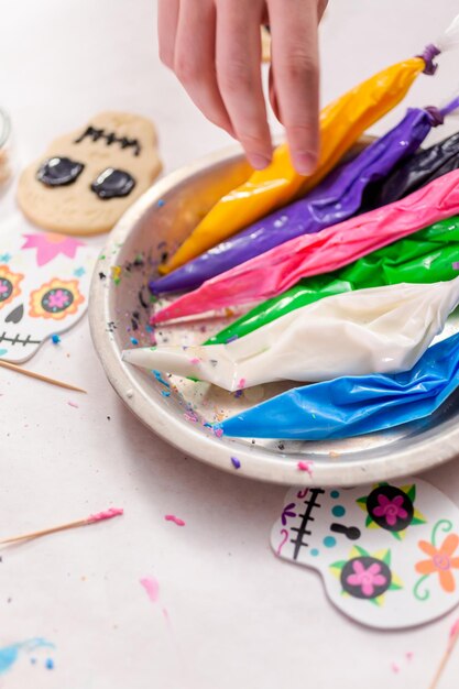 Piping bag with different color of royal icing.