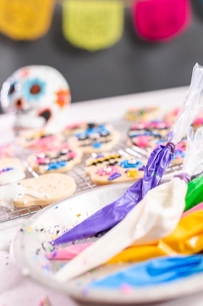 Piping bag with different color of royal icing.