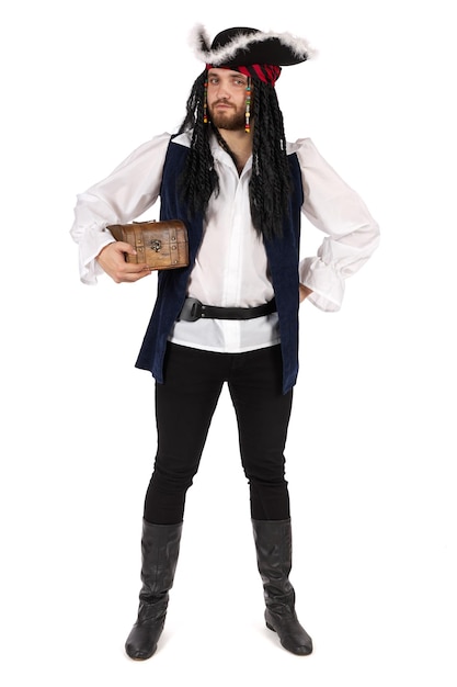 A pirate in a suit is standing stands and holds a small treasure chest.