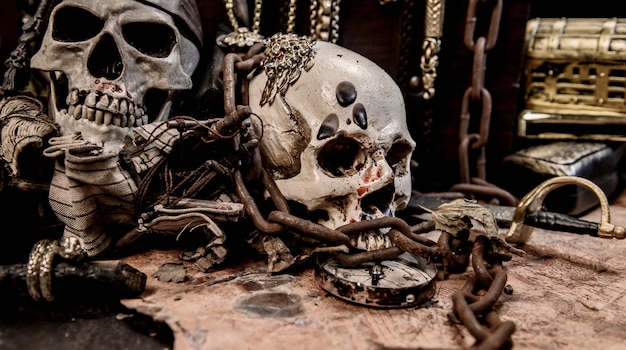 Pirate with human skull. Treasure chest and gold. Discovery equipment and explorer for disappear fortune.
