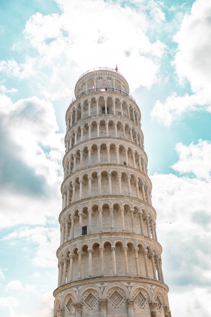 Pisa tower on the blue sky with clouds without people