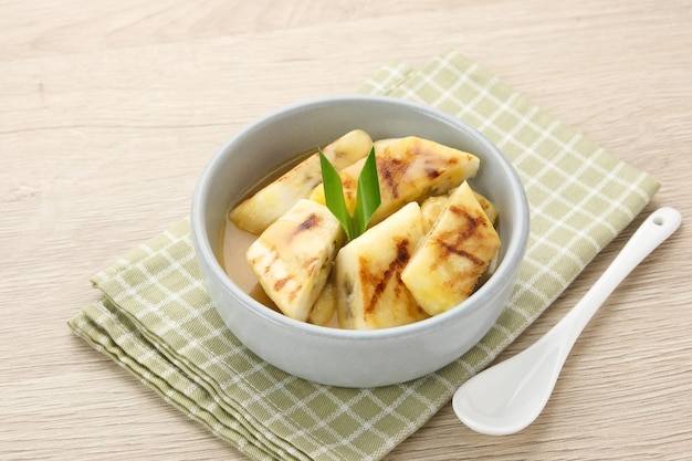 Pisang Gapit or Pisang Epe grilled banana with palm sugar sauce Indonesian traditional food