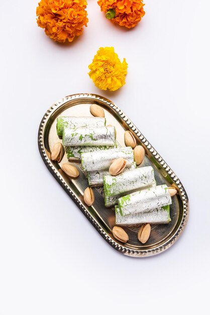 Pista Roll Or Pistachio Rolls Mithai or sigar Indian sweet or dessert for festivals