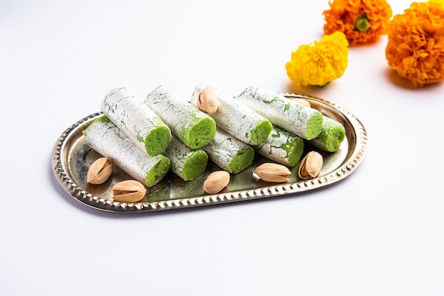 Pista roll or pistachio rolls mithai or sigar indian sweet or\
dessert for festivals