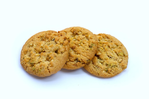 Pistachio and almond cookies on white background