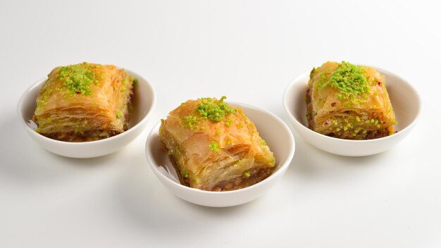 Pistachio baklava on a white background. dessert