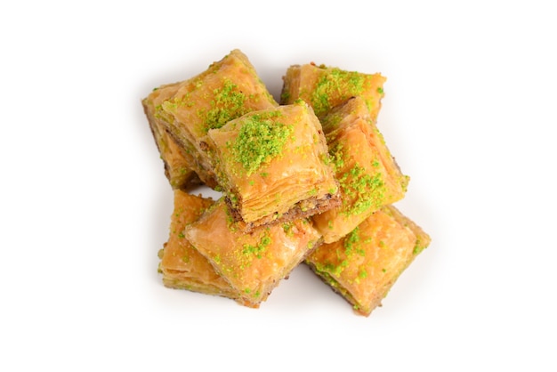 Pistachio baklava on a white surface