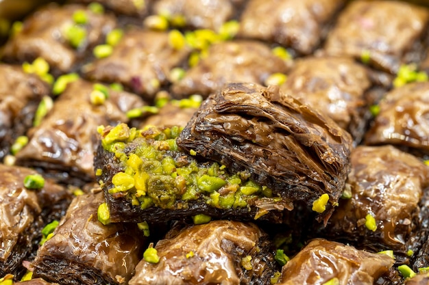 Pistachio chocolate baklava traditional middle eastern flavors
local name cikolatali baklava close up