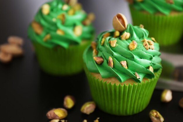 Pistachio cupcakes on table