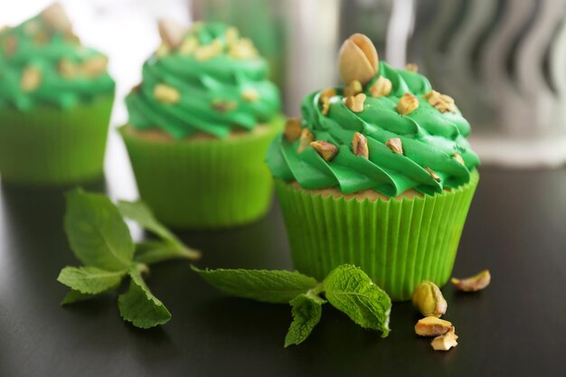 Pistachio cupcakes on table