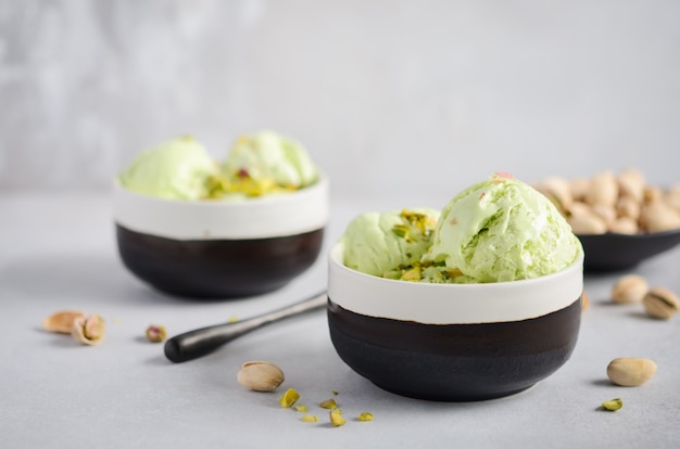 Photo pistachio ice cream in a bowls.